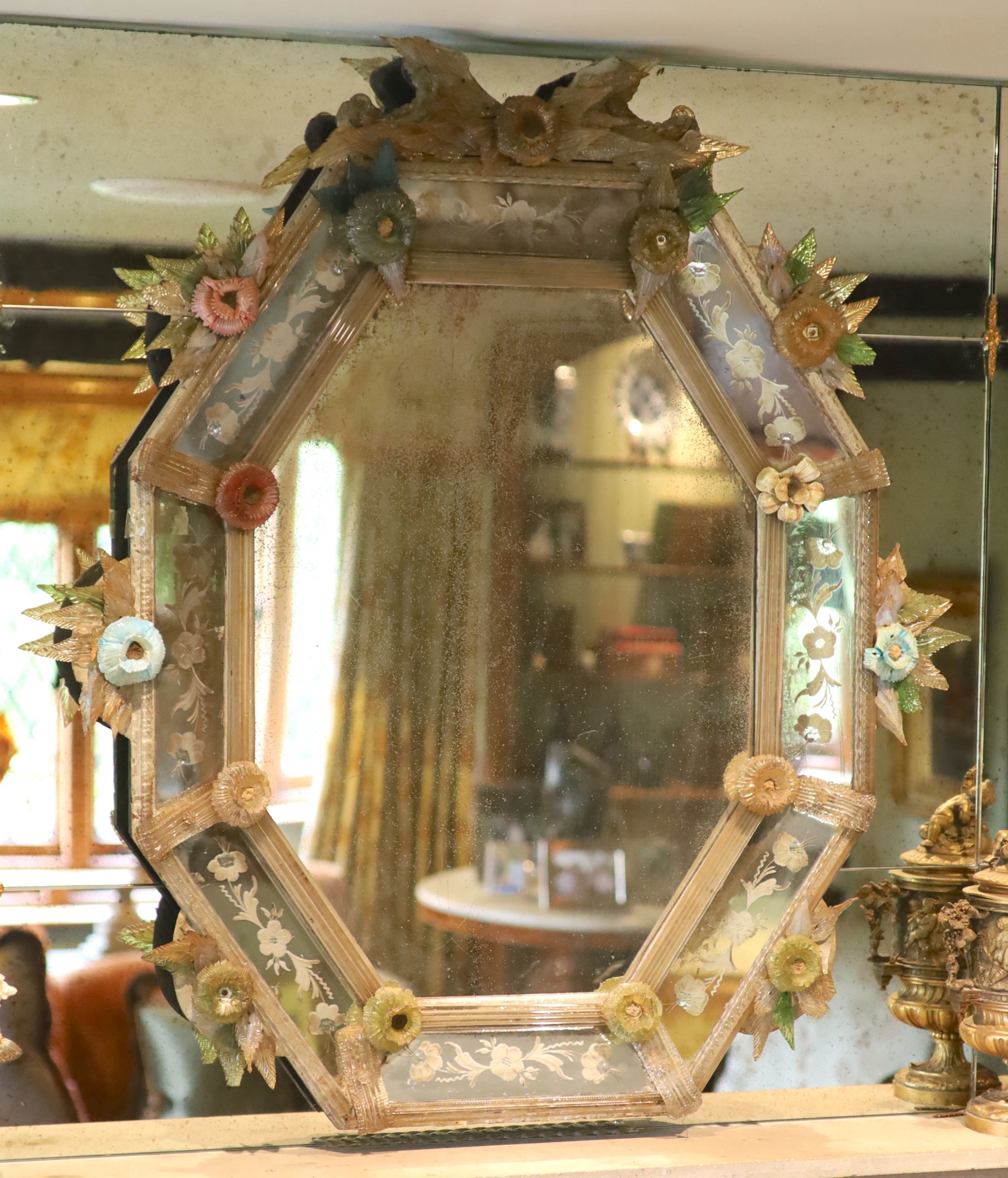 A Venetian etched glass wall mirror, with elaborate floral encrusted frame, width 91cm height 100cm